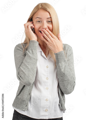 Photo: Business woman talking on a cell phone Business woman talking on a cell phone