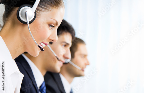 Photo: Three support phone operators at workplace Three support phone operators at workplace
