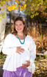 Photo: Happy pregnant woman in fall nature Happy pregnant woman in fall nature