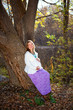 Photo: Happy pregnant woman in fall nature Happy pregnant woman in fall nature