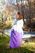 Photo: Happy pregnant woman in fall nature Happy pregnant woman in fall nature