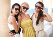 Three adorable women wearing sunglasses