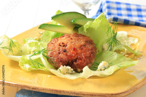 Photo: Meat patty on lettuce leaves Meat patty on lettuce leaves