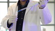 Chemist Using a Pipette