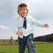 boy running meadow