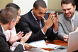 Multi ethnic business team at a meeting. Interacting