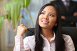 young beautiful asian woman in a business environment