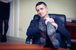 businessman relaxing at the office with his shoes on the desk