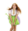 Photo: junge frau in dirndl käpft mit wind auf weissem hintergrund junge frau in dirndl käpft mit wind auf weissem hintergrund
