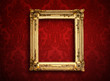 Photo: Empty golden painting frame on vintage wallpaper Empty golden painting frame on vintage wallpaper