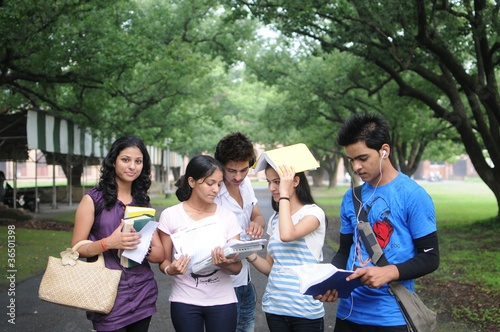 Photo: Group of Indian college students discussing a topic. Group of Indian college students discussing a topic.