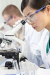 Chinese Female Woman Scientist & Microscope In Laboratory Chinese Female Woman Scientist & Microscope In Laboratory
