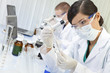 Chinese Female Woman Scientist With Test Tube In Laboratory