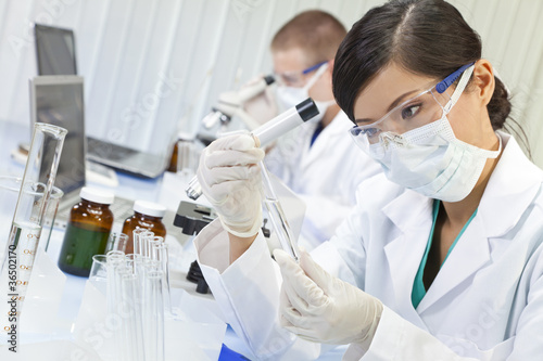 Photo: Chinese Female Woman Scientist With Test Tube In Laboratory Chinese Female Woman Scientist With Test Tube In Laboratory