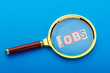 Unemployment concept with magnifying glass