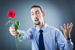 Young man with red rose