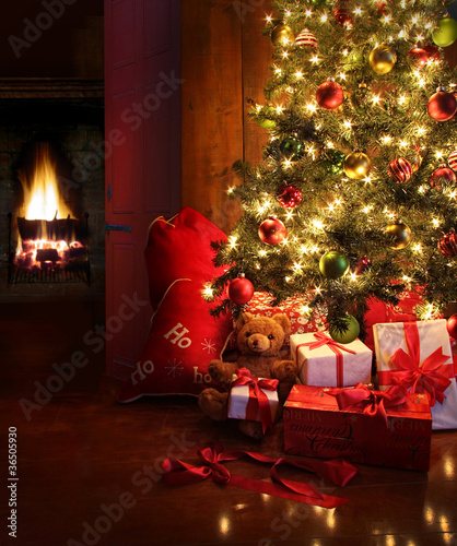 Photo: Christmas scene with tree and fire in background Christmas scene with tree and fire in background