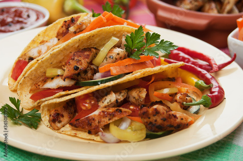 Photo: Grilled chicken meat in taco shells Grilled chicken meat in taco shells