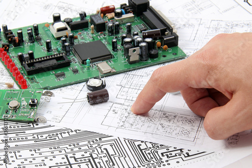 Photo: Electronic circuit boards on the background of electronic scheme Electronic circuit boards on the background of electronic scheme
