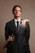 Man with women's hands on him