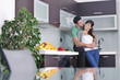 young couple have fun in modern kitchen