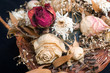 Bouquet of withered flowers in a wicker basket