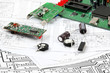 Electronic circuit boards on the background of electronic scheme