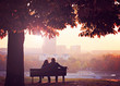 Romantic Couple on a Bench by the River in Autumn