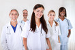 Portrait of a young doctor smiling with colleagues