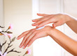 Female applying moisturizer to her Hands Female applying moisturizer to her Hands