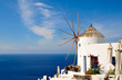 Old windmill in Santorini overlooking the sea