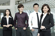 Asian Business colleagues standing in a row and smiling