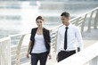 Photo: Asian Business Man and Woman Walking Asian Business Man and Woman Walking