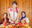 Women  eating pancake during  Shrovetide
