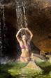 Woman swimming in a natural pool.