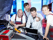 Foto: Motor mechanics are satisfied with tuning the engine of a car Motor mechanics are satisfied with tuning the engine of a car
