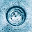 Water and detergent going down the sink