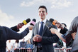 Politician speaking to reporters