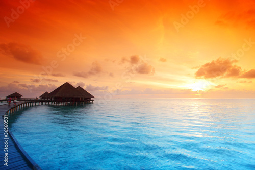 Foto: maldivian houses on sunrise maldivian houses on sunrise