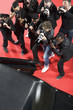 Paparazzi taking photos of celebrity's car
