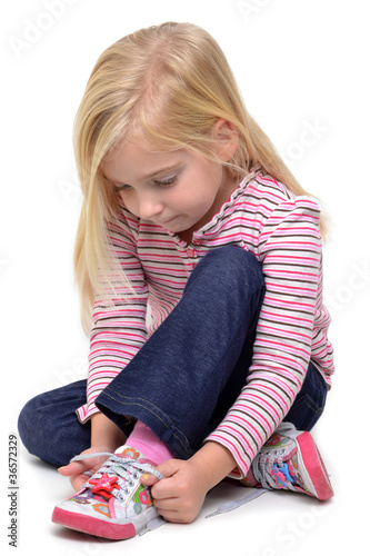 Photo: Girl Tying Laces Girl Tying Laces
