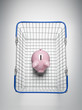 Piggy bank in shopping basket