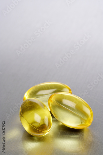Photo: Three cod liver oil pills Three cod liver oil pills