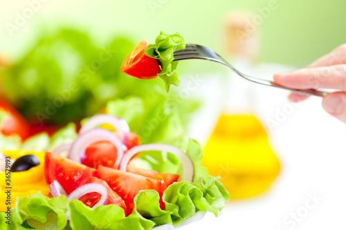 Photo: healthy food fresh vegetable salad and fork healthy food fresh vegetable salad and fork
