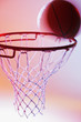 Basketball on rim of hoop