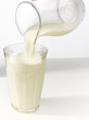 Pouring milk in a glass Pouring milk in a glass