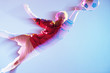 Blurred view of soccer player lunging for ball