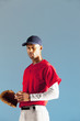 Baseball player holding ball and glove