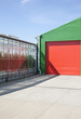 Greenhouse and warehouse under blue sky