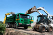 Two excavators loaded dumper